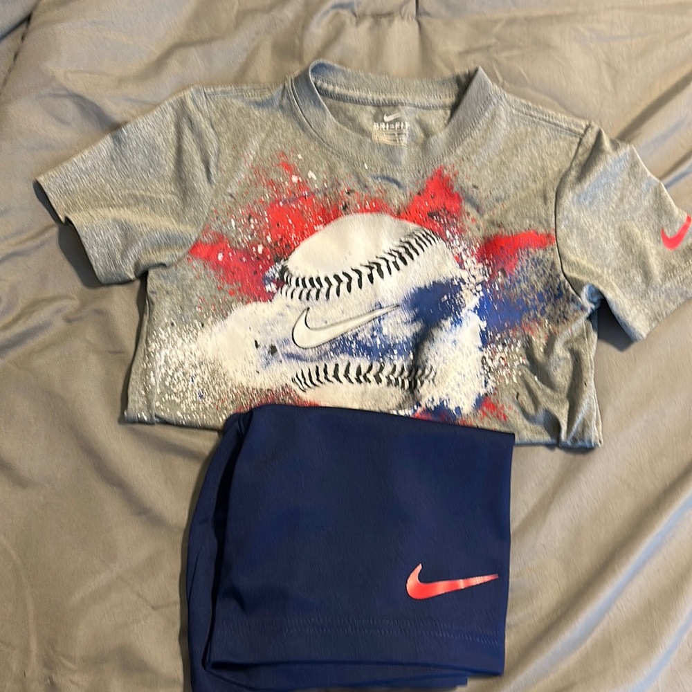 Nike boy size 7 short sleeve shirt and short set.